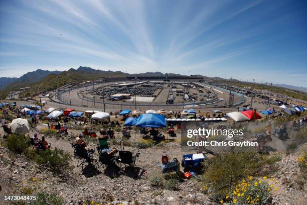 Fans look on from the hillside area during the NASCAR Cup Series United Rentals Work United 500 at Phoenix Raceway on March 12, 2023 in Avondale,...