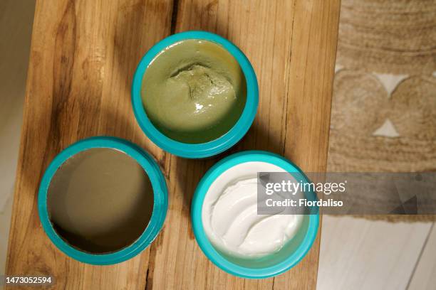 jar with white oily body cream or anti-cellulite scrub - celulite stock pictures, royalty-free photos & images