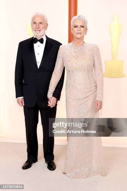 Christopher Guest and Jamie Lee Curtis attend the 95th Annual Academy Awards on March 12, 2023 in Hollywood, California.