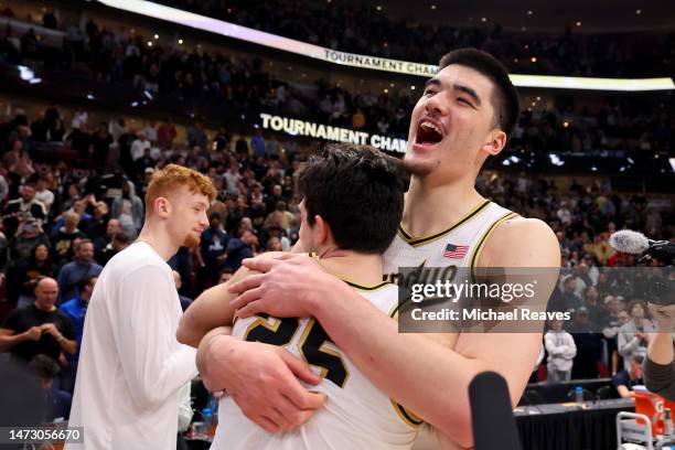 Zach Edey of the Purdue Boilermakers celebrates with Ethan Morton after defeating the Penn State Nittany Lions in the Big Ten Basketball Tournament...