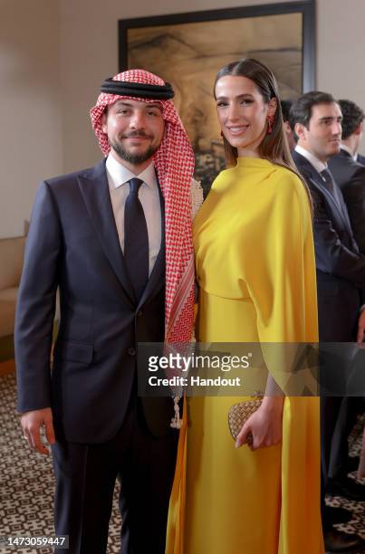 In this handout from the Jordanian Royal Court, Crown Prince Hussein and his Fiancee Rajwa Al Saif at the Royal wedding of Princess Iman Bint...
