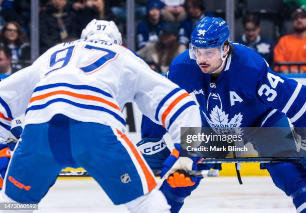 Auston Matthews of the Toronto Maple Leafs takes a face off against Connor McDavid of the Edmonton Oilers during the first period at the Scotiabank...