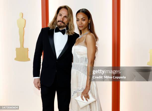 Marco Perego and Zoe Saldana attend the 95th Annual Academy Awards on March 12, 2023 in Hollywood, California.