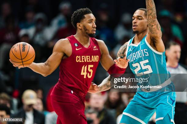 Washington of the Charlotte Hornets guards Donovan Mitchell of the Cleveland Cavaliers in the first quarter during their game at Spectrum Center on...