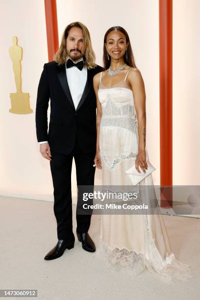 Marco Perego and Zoe Saldana attend the 95th Annual Academy Awards on March 12, 2023 in Hollywood, California.