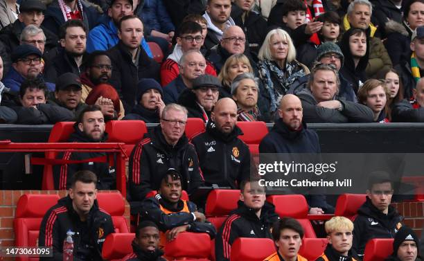 Erik ten Hag manager of Manchester United sits alongside assistants Mitchell van der Gaag and Steve McClaren during the Premier League match between...