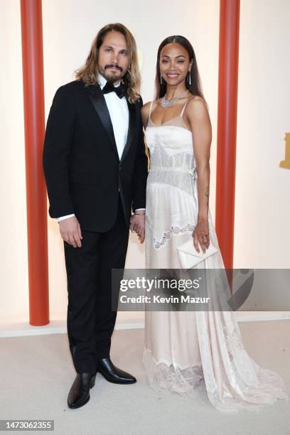Marco Perego Saldana and Zoe Saldana attend the 95th Annual Academy Awards on March 12, 2023 in Hollywood, California.