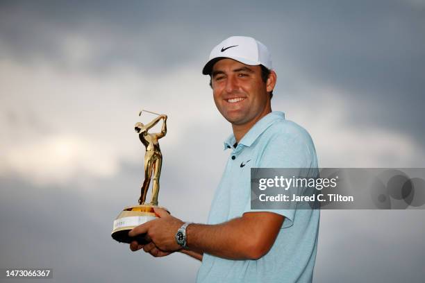 Scottie Scheffler of the United States celebrates with the trophy after winning during the final round of THE PLAYERS Championship on THE PLAYERS...