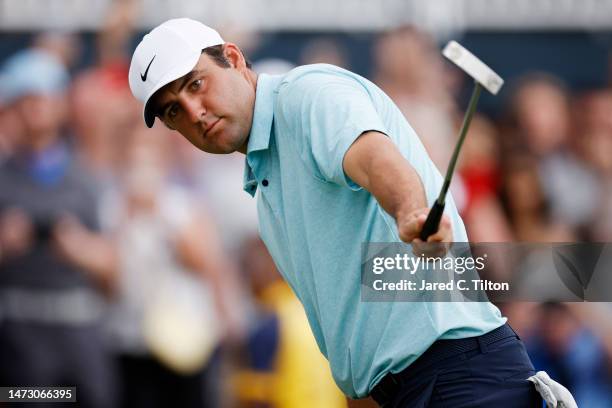 Scottie Scheffler of the United States watches his final putt to win on the 18th green during the final round of THE PLAYERS Championship on THE...