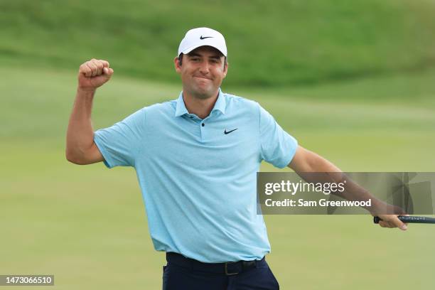 Scottie Scheffler of the United States celebrates after making his putt to win on the 18th green during the final round of THE PLAYERS Championship...