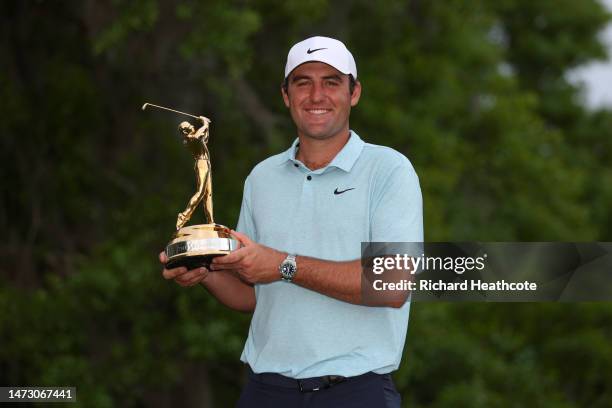 Scottie Scheffler of the United States celebrates with the trophy after winning during the final round of THE PLAYERS Championship on THE PLAYERS...