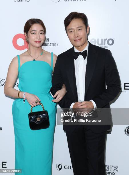 Min Jung Rhee and Byung Hun Lee attend Elton John AIDS Foundation's 31st annual academy awards viewing party on March 12, 2023 in West Hollywood,...