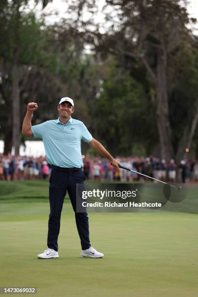 Scottie Scheffler of the United States celebrates after making his putt to win on the 18th green during the final round of THE PLAYERS Championship...