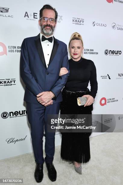 Eric White and Patricia Arquette attend the Elton John AIDS Foundation's 31st Annual Academy Awards Viewing Party on March 12, 2023 in West...