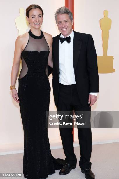 Anna Eberstein and Hugh Grant attends the 95th Annual Academy Awards on March 12, 2023 in Hollywood, California.