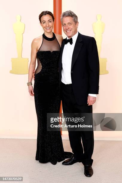 Anna Eberstein and Hugh Grant attend the 95th Annual Academy Awards on March 12, 2023 in Hollywood, California.
