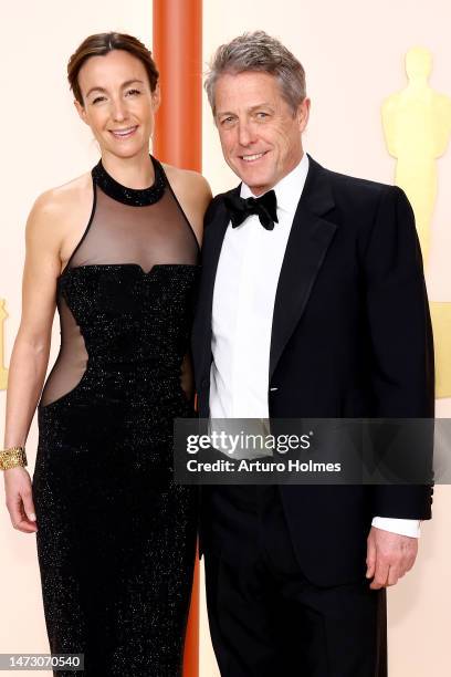 Anna Eberstein and Hugh Grant attend the 95th Annual Academy Awards on March 12, 2023 in Hollywood, California.