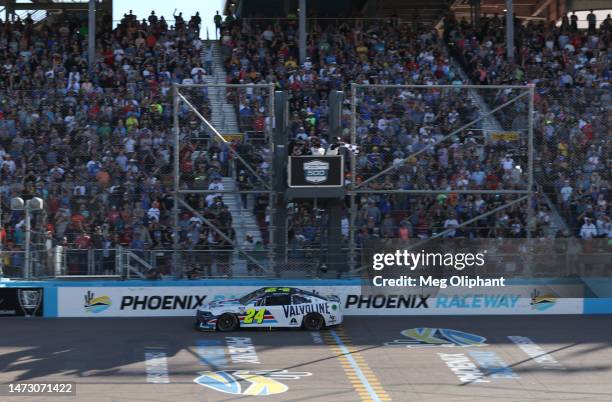 William Byron, driver of the Valvoline Chevrolet, crosses the finish line to win the NASCAR Cup Series United Rentals Work United 500 at Phoenix...