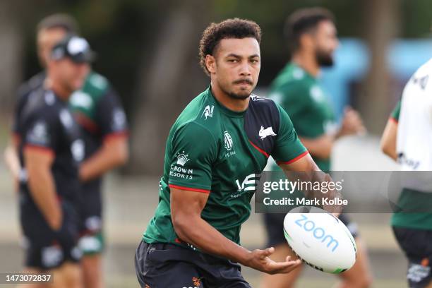 Isaiah Tass passes during a South Sydney Rabbitohs NRL training session at Redfern Oval on March 13, 2023 in Sydney, Australia.