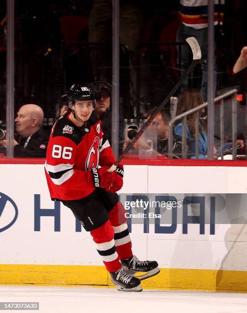 Jack Hughes of the New Jersey Devils celebrates his goal against the Carolina Hurricanes during the first period at Prudential Center on March 12,...