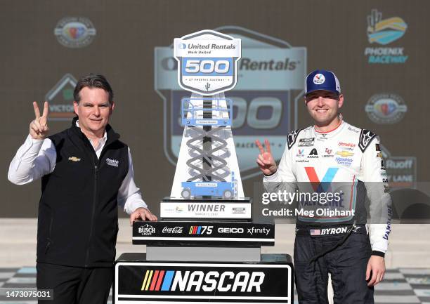 William Byron, driver of the Valvoline Chevrolet, and Jeff Gordon, Vice Chairman of Hendrick Motorsports celebrate in victory lane after winning the...
