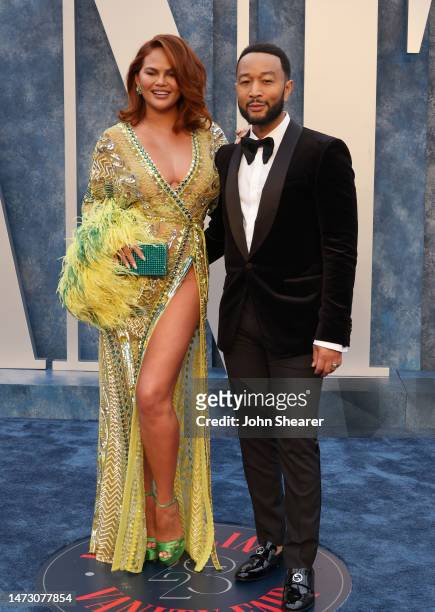 Chrissy Teigen and John Legend attend the 2023 Vanity Fair Oscar Party Hosted By Radhika Jones at Wallis Annenberg Center for the Performing Arts on...