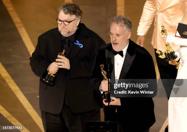 Guillermo del Toro and Mark Gustafson accept the Best Animated Feature Film award for "Guillermo del Toro's Pinocchio" onstage during the 95th Annual...