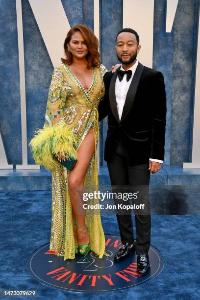 Chrissy Teigen and John Legend attend the 2023 Vanity Fair Oscar Party Hosted By Radhika Jones at Wallis Annenberg Center for the Performing Arts on...