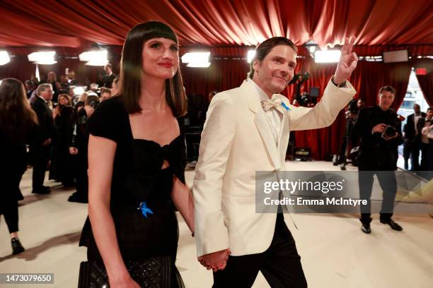 Felicitas Rombold and Daniel Brühl attend the 95th Annual Academy Awards on March 12, 2023 in Hollywood, California.