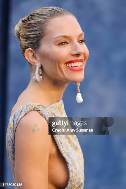 Sienna Miller attends the 2023 Vanity Fair Oscar Party Hosted By Radhika Jones at Wallis Annenberg Center for the Performing Arts on March 12, 2023...