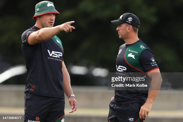 Sam Burgess speaks to Rabbitohs head coach Jason Demetriou during a South Sydney Rabbitohs NRL training session at Redfern Oval on March 13, 2023 in...