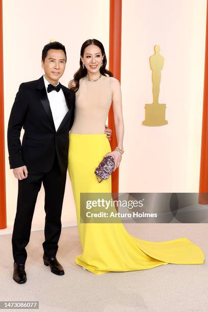 Donnie Yen and Cissy Wang attend the 95th Annual Academy Awards on March 12, 2023 in Hollywood, California.