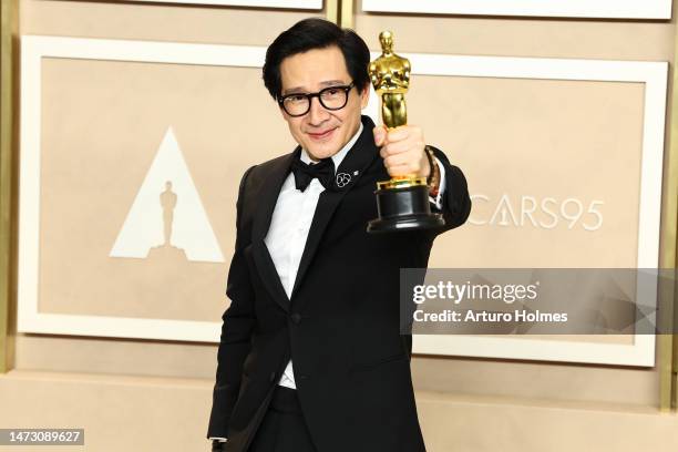 Ke Huy Quan, winner of the Best Supporting Actor award for "Everything Everywhere All at Once," poses in the press room during the 95th Annual...