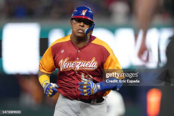 Salvador Perez of Venezuela rounds second base after hitting a home run in the second inning against Puerto Rico at loanDepot park on March 12, 2023...