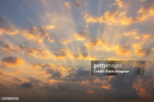 beautiful sky at sunrise with colorful clouds in the background. - sun radiation stock pictures, royalty-free photos & images
