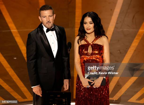 Antonio Banderas and Salma Hayek walk onstage during the 95th Annual Academy Awards at Dolby Theatre on March 12, 2023 in Hollywood, California.