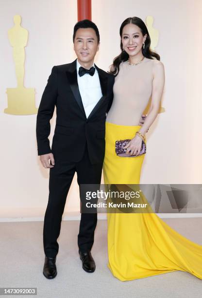 Donnie Yen and Cissy Wang attend the 95th Annual Academy Awards on March 12, 2023 in Hollywood, California.