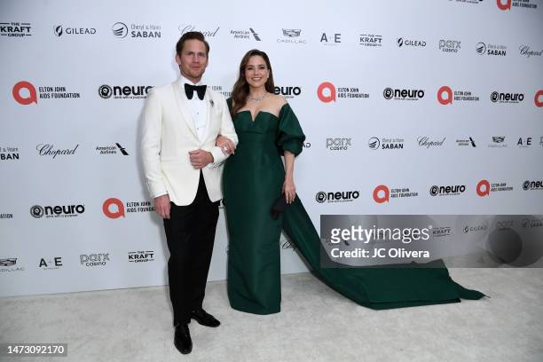 Grant Hughes and Sophia Bush attend the Elton John AIDS Foundation's 31st Annual Academy Awards Viewing Party on March 12, 2023 in West Hollywood,...