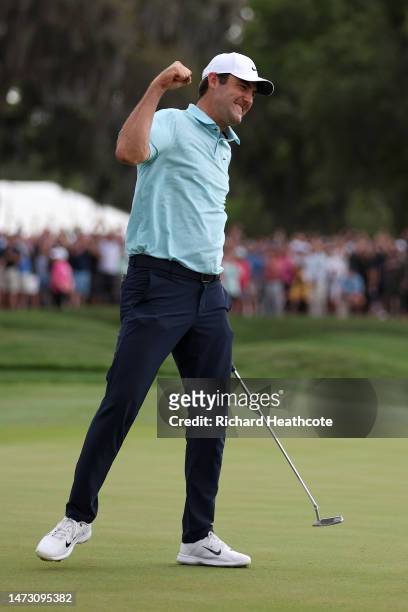 Scottie Scheffler of the United States celebrates after making his putt to win on the 18th green during the final round of THE PLAYERS Championship...