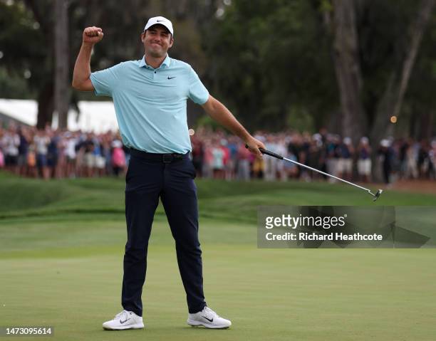Scottie Scheffler of the United States celebrates after making his putt to win on the 18th green during the final round of THE PLAYERS Championship...