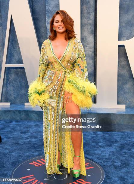 Chrissy Teigen arrives at the Vanity Fair Oscar Party Hosted By Radhika Jones at Wallis Annenberg Center for the Performing Arts on March 12, 2023 in...