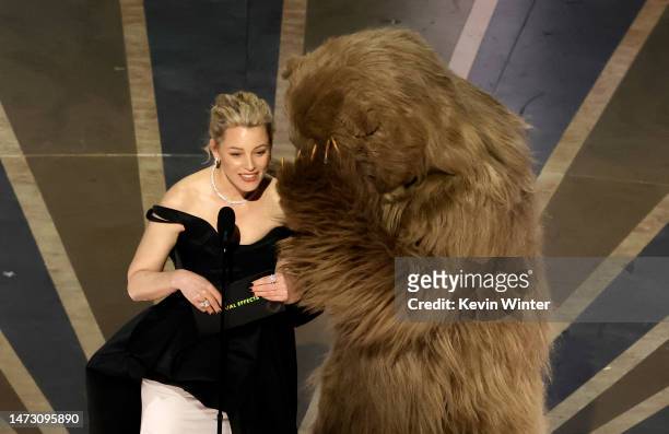 Elizabeth Banks and Cocaine Bear speak onstage during the 95th Annual Academy Awards at Dolby Theatre on March 12, 2023 in Hollywood, California.