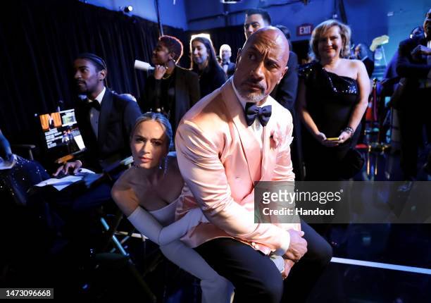 In this handout photo provided by A.M.P.A.S., Emily Blunt and Dwayne Johnson are seen backstage during the 95th Annual Academy Awards on March 12,...