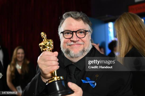 In this handout photo provided by A.M.P.A.S., Best Animated Feature winner of "Guillermo del Toro's Pinocchio," Director, Guillermo del Toro is seen...