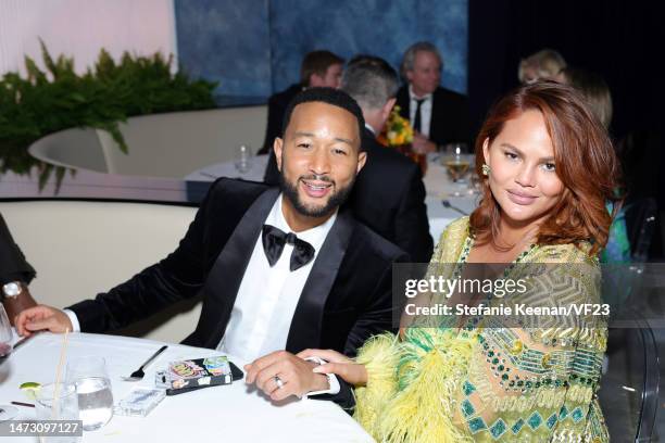 John Legend and Chrissy Teigen attend the 2023 Vanity Fair Oscar Party Hosted By Radhika Jones at Wallis Annenberg Center for the Performing Arts on...