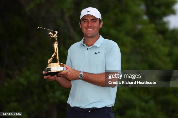 Scottie Scheffler of the United States celebrates with the trophy after winning during the final round of THE PLAYERS Championship on THE PLAYERS...