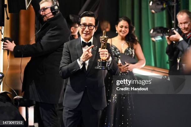In this handout photo provided by A.M.P.A.S., Best Supporting Actor winner for "Everything Everywhere All at Once," Ke Huy Quan is seen backstage...