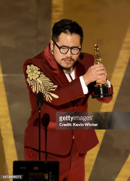 Daniel Kwan accepts the award for Best Original Screenplay for "Everything Everywhere All at Once" onstage during the 95th Annual Academy Awards at...