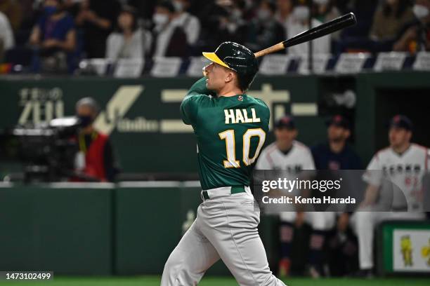 Alex Hall of Australia hits a solo home run to make it 1-0 in the first inning during the World Baseball Classic Pool B game between Australia and...