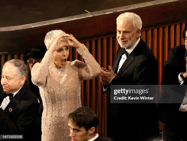 Jamie Lee Curtis and Christopher Guest react to Paul Rogers winning the Best Film Editing award for "Everything Everywhere All at Once" during the...